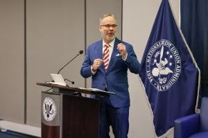 Chairman Harper speaking at the 90th Anniversary of the Federal Credit Union Act event at NCUA headquarters. Credit/NCUA