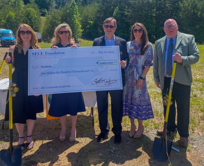 From left to right at a groundbreaking event for the new facility: Vecinos CEO Marianne Rupp Martinez with SECU Foundation representatives Jama Campbell, executive director; Chris Ayers, board chair; Parker Patterson, senior grants officer; and Scott Southern, director of grants administration