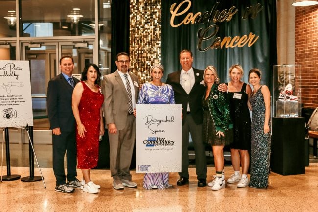 From left to right: Fox Communities CU executive team members Kory Kitowski (Chief Information Officer), Krista Draheim (SVP of Strategic Planning & Delivery), Chris Allen (President/CEO), Tommie Preslaski (Chief Experience Officer), Mitchell Musial (Chief Legal Officer), Nicole Hanneman (Director of Executive Operations), Niki Schaumberg (CFO) and Melanie Draheim (Chief Marketing Officer) at the 