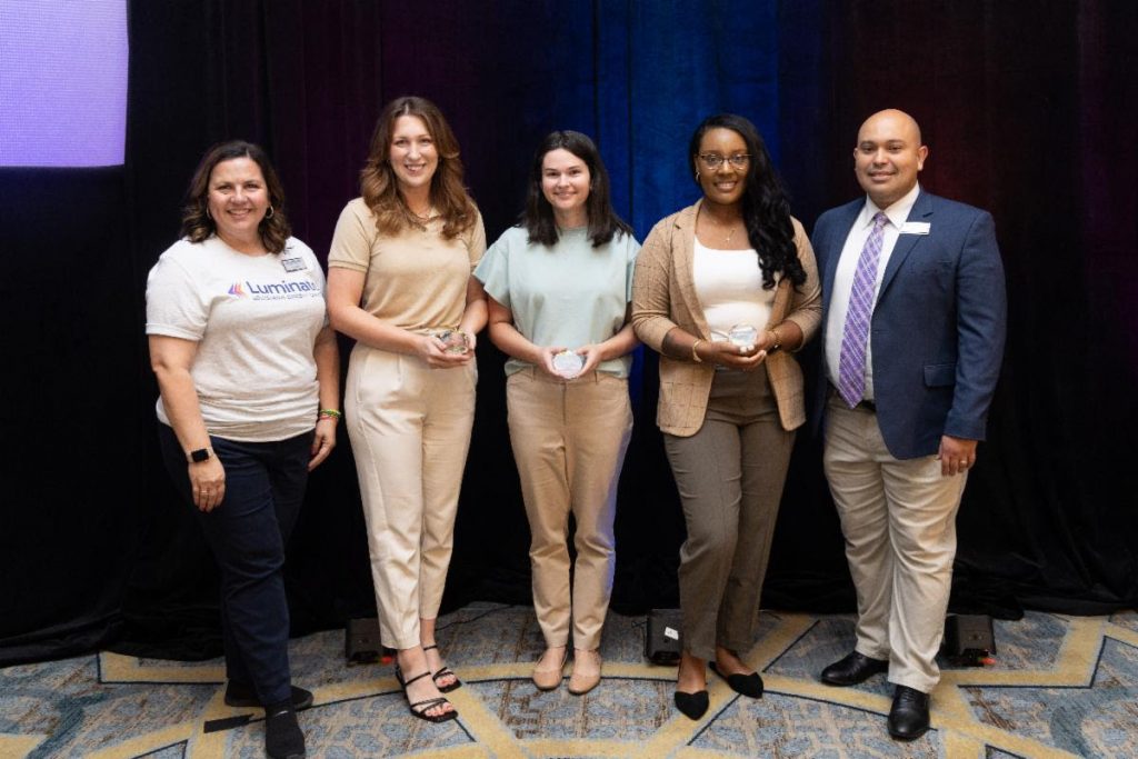 From left to right: Luminate Director of Impact & Foundation Lynette Hazelton, CSE FCU Marketing Supervisor Morgan Algero, InStep FCU Marketing Officer Kara Hornosky, Neighbors FCU Retail Trainer/Support Specialist Shaynell Jacobs and Luminate President/CEO Juan Fernandez. 