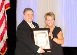 Paul Obermeyer with League Chairwoman Nina Baker.