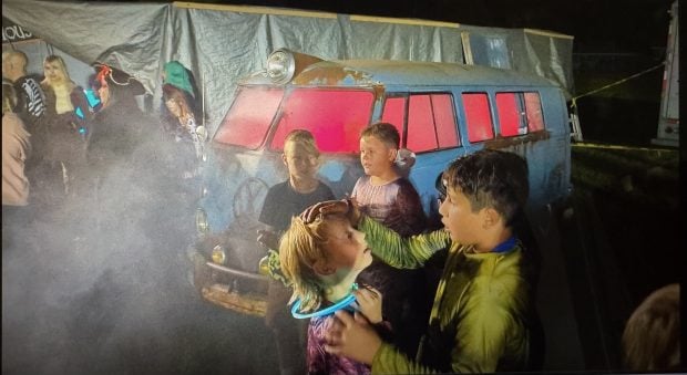 Terrified kids after going through Jim Stickley's haunted house.