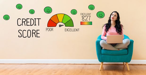 person sitting in chair looking at credit score