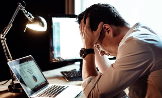 worried businessman at computer